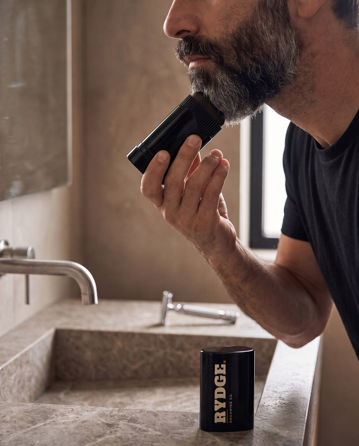 Man applying RYDGE to his beard